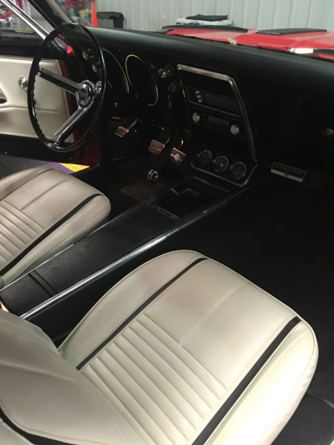 Red 1967 Chevrolet Camaro with White interior