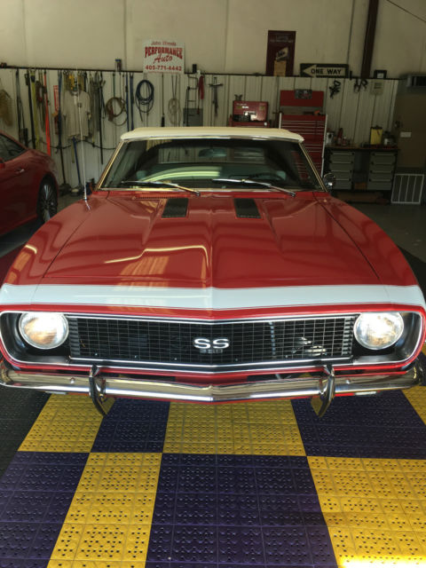 Red 1967 Chevrolet Camaro with White interior