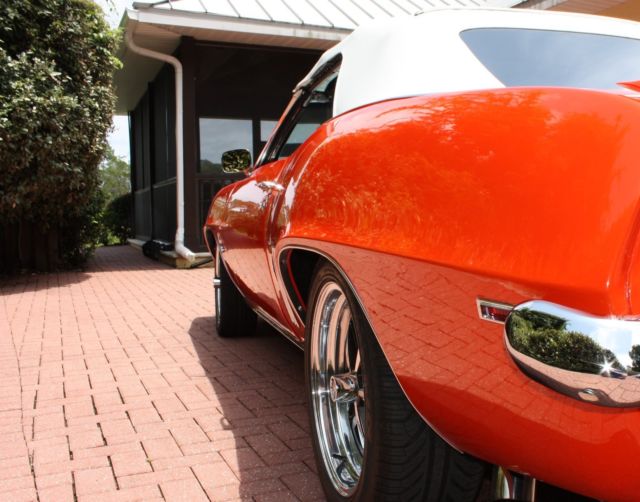 Orange 1969 Chevrolet Camaro Convertible with White interior