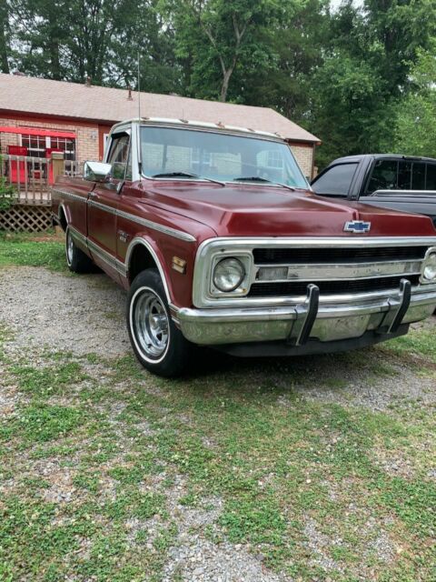 Red 1969 Chevrolet C-10 1/2 ton fleet side pick up with Red interior