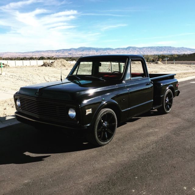 Black 1969 Chevrolet C-10 Stepside with Red interior