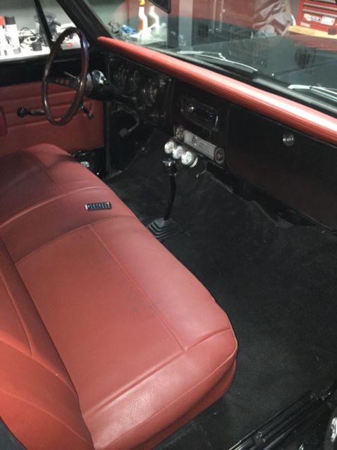 Black 1969 Chevrolet C-10 Stepside with Red interior