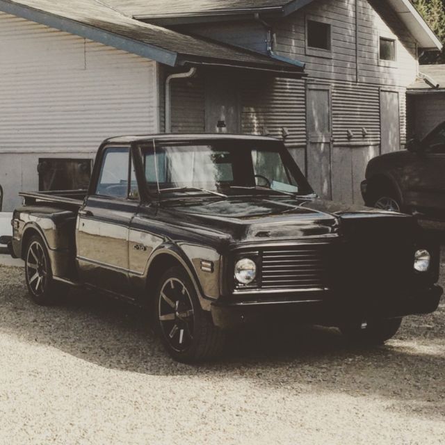 Black 1969 Chevrolet C-10 Stepside with Red interior