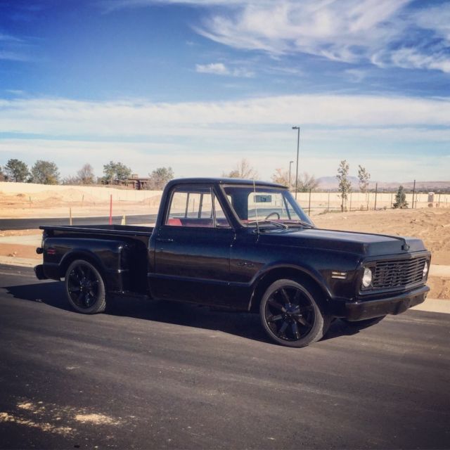 Black 1969 Chevrolet C-10 Stepside with Red interior