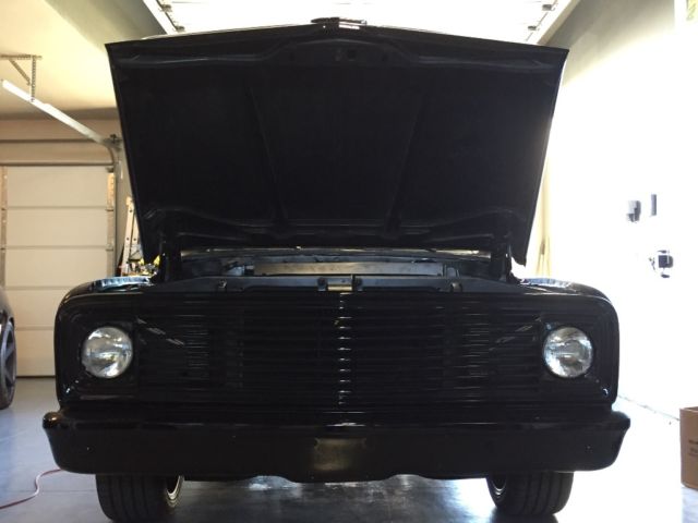 Black 1969 Chevrolet C-10 Stepside with Red interior