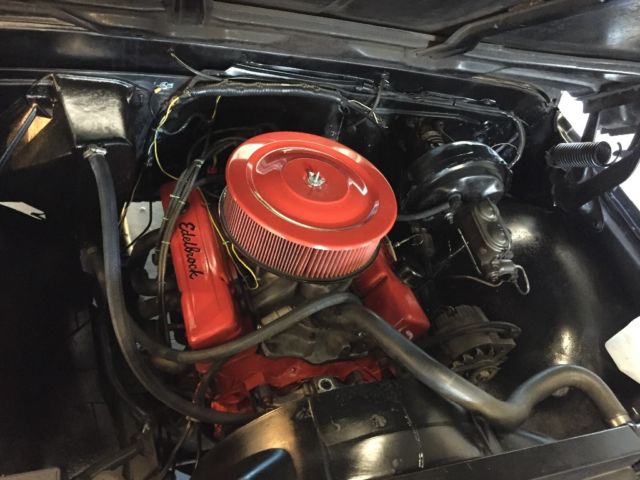 Black 1969 Chevrolet C-10 Stepside with Red interior