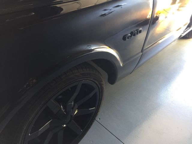 Black 1969 Chevrolet C-10 Stepside with Red interior