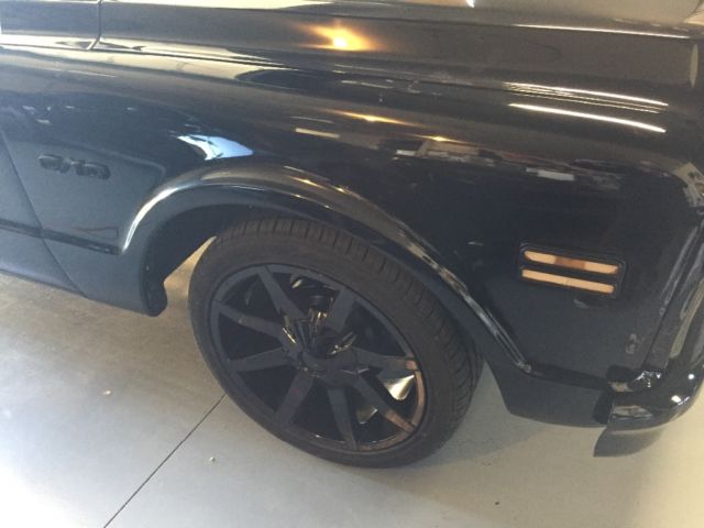 Black 1969 Chevrolet C-10 Stepside with Red interior