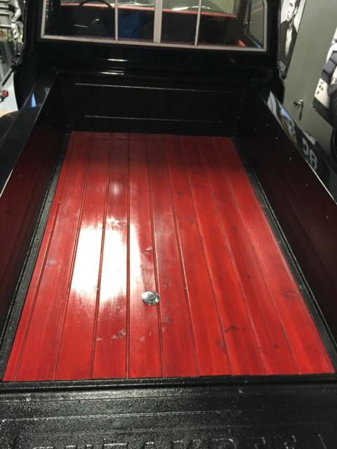 Black 1969 Chevrolet C-10 Stepside with Red interior