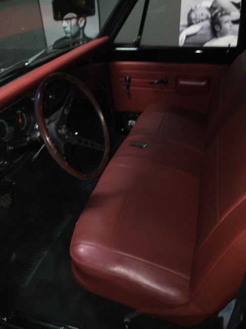 Black 1969 Chevrolet C-10 Stepside with Red interior