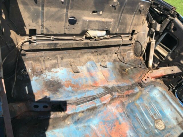 Blue 1969 Chevrolet Impala Convertible with White interior