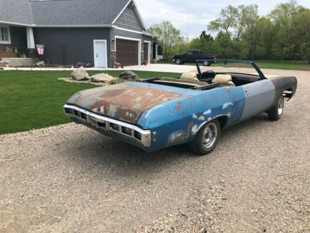 Blue 1969 Chevrolet Impala Convertible with White interior