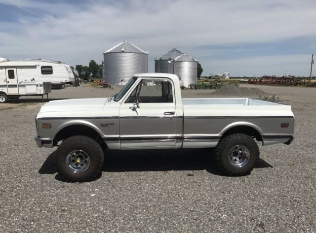 White 1970 Chevrolet C-10 pick up with Green interior