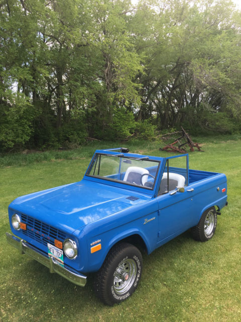 Blue 1971 Ford Bronco with white/gray interior