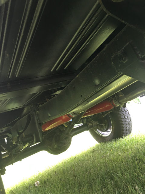Blue 1971 Ford Bronco with white/gray interior