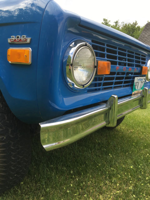 Blue 1971 Ford Bronco with white/gray interior