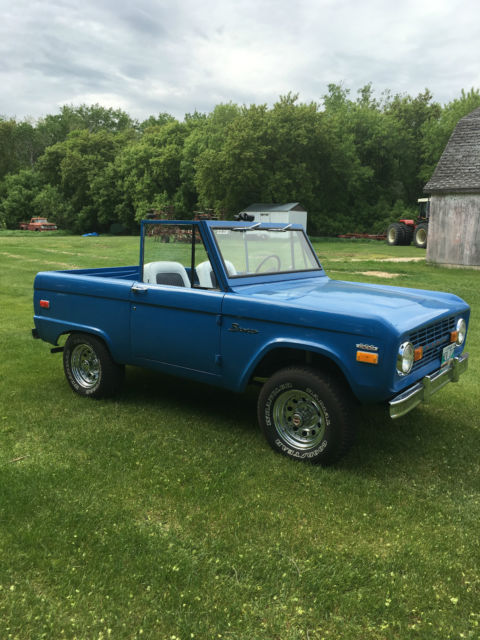Blue 1971 Ford Bronco with white/gray interior