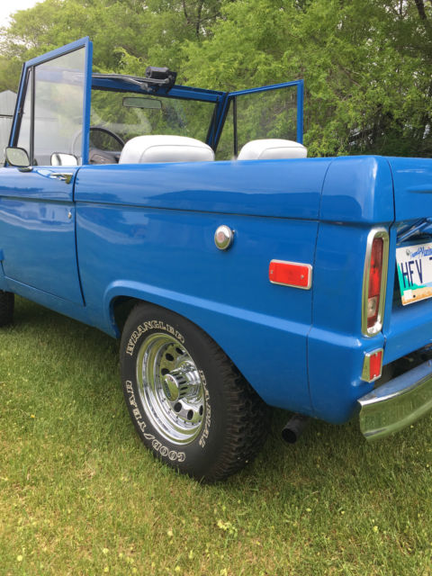 Blue 1971 Ford Bronco with white/gray interior