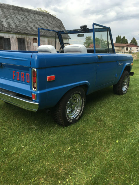 Blue 1971 Ford Bronco with white/gray interior
