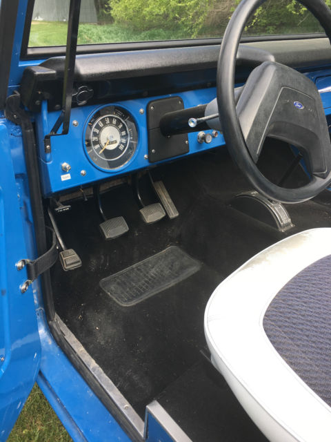 Blue 1971 Ford Bronco with white/gray interior