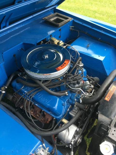 Blue 1971 Ford Bronco with white/gray interior