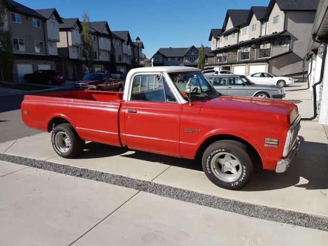 Red 1972 Chevrolet C-10 reg cab with orange /white interior