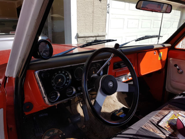 Red 1972 Chevrolet C-10 reg cab with orange /white interior