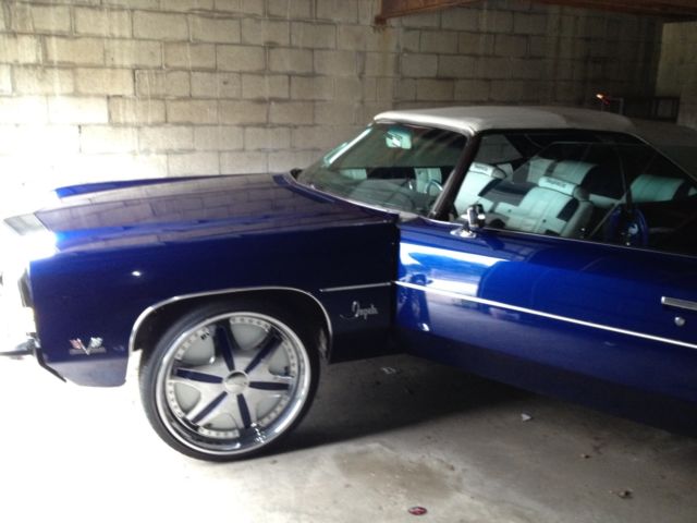 Blue 1972 Chevrolet Impala Convertible with blue and white interior