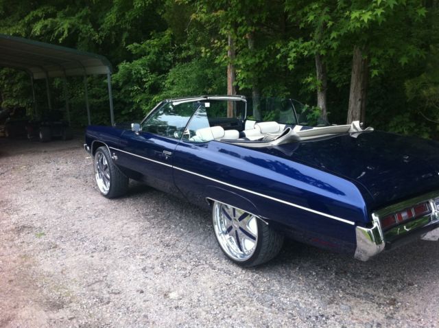 Blue 1972 Chevrolet Impala Convertible with blue and white interior