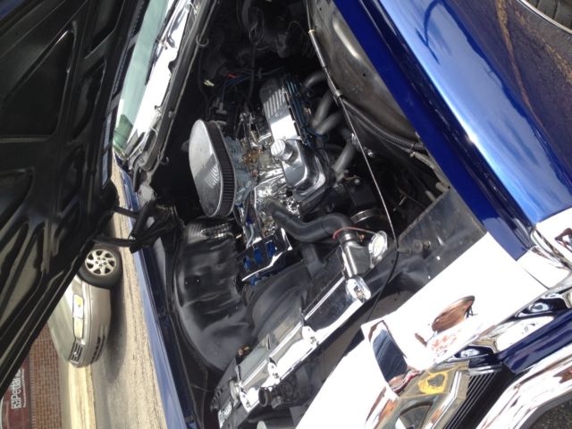 Blue 1972 Chevrolet Impala Convertible with blue and white interior