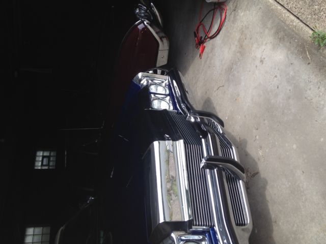 Blue 1972 Chevrolet Impala Convertible with blue and white interior