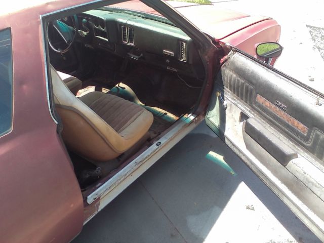 Maroon/silver 1973 Chevrolet Chevelle Coupe with Black interior