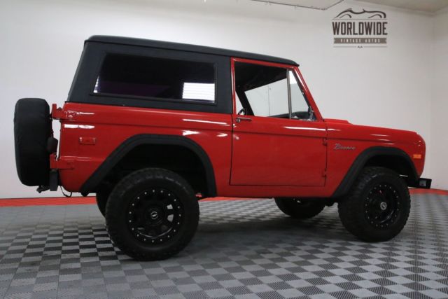 Red 1974 Ford Bronco with Black interior