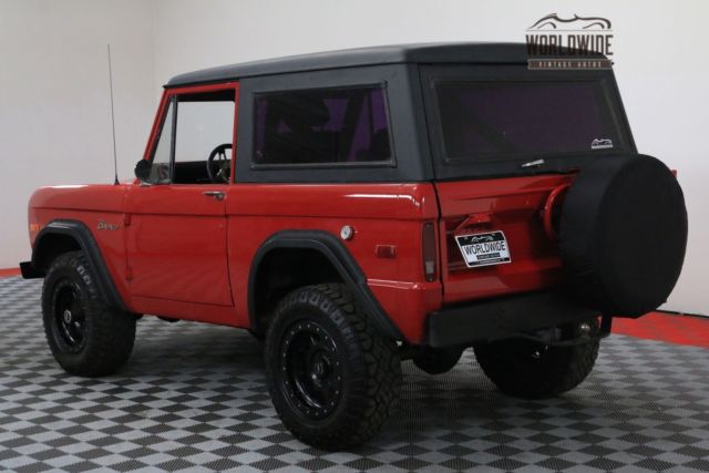 Red 1974 Ford Bronco with Black interior