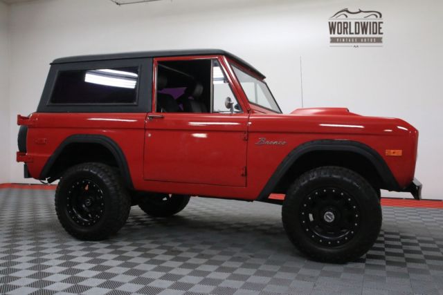 Red 1974 Ford Bronco with Black interior