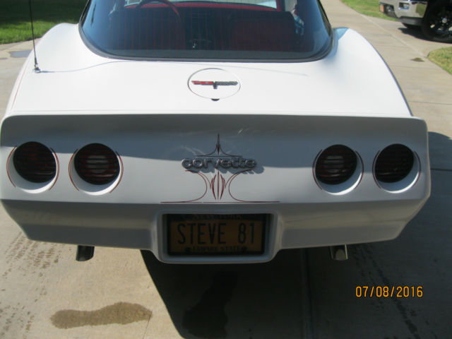 White 1981 Chevrolet Corvette Coupe with red interior