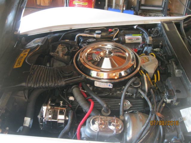 White 1981 Chevrolet Corvette Coupe with red interior