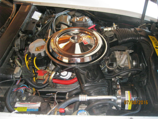 White 1981 Chevrolet Corvette Coupe with red interior