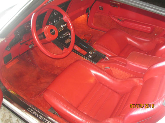 White 1981 Chevrolet Corvette Coupe with red interior