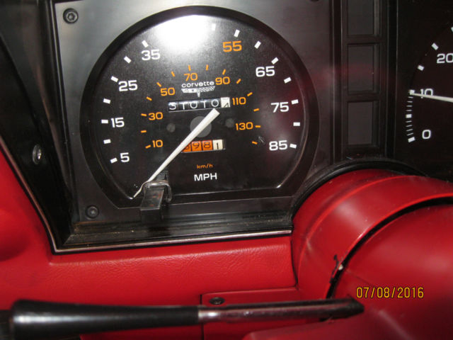 White 1981 Chevrolet Corvette Coupe with red interior