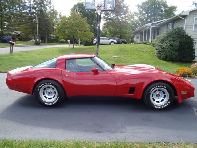 red 1981 Chevrolet Corvette with tan interior