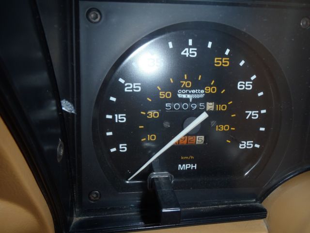 red 1981 Chevrolet Corvette with tan interior