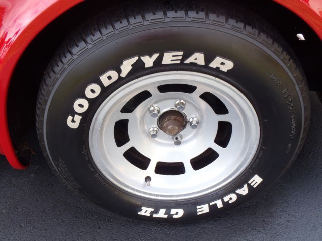 red 1981 Chevrolet Corvette with tan interior
