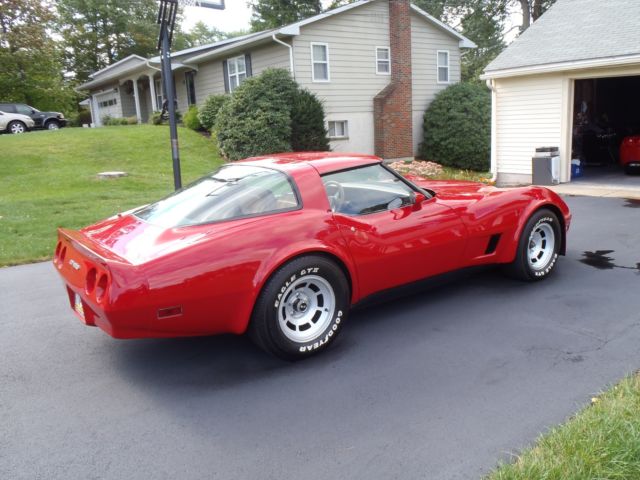 red 1981 Chevrolet Corvette with tan interior