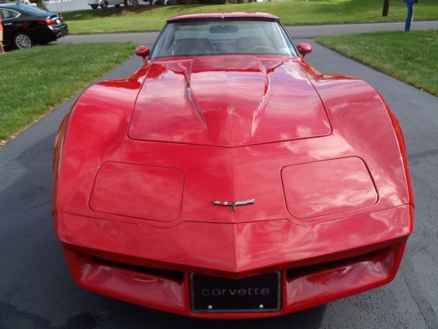 red 1981 Chevrolet Corvette with tan interior