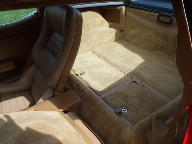 red 1981 Chevrolet Corvette with tan interior