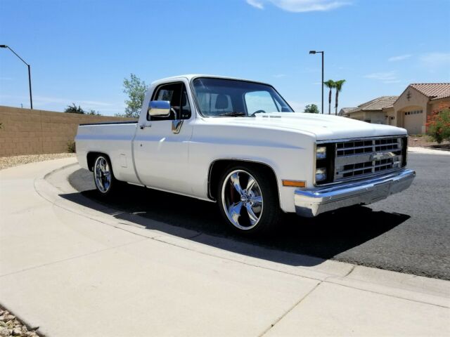 Orange 1986 Chevrolet C-10 Standard Cab Pickup with Black interior