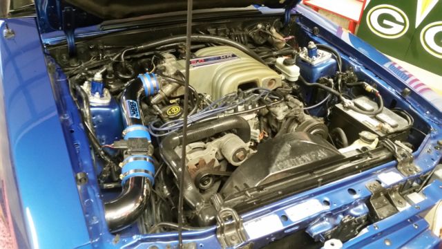 Blue 1991 Ford Mustang Convertible with Tan interior