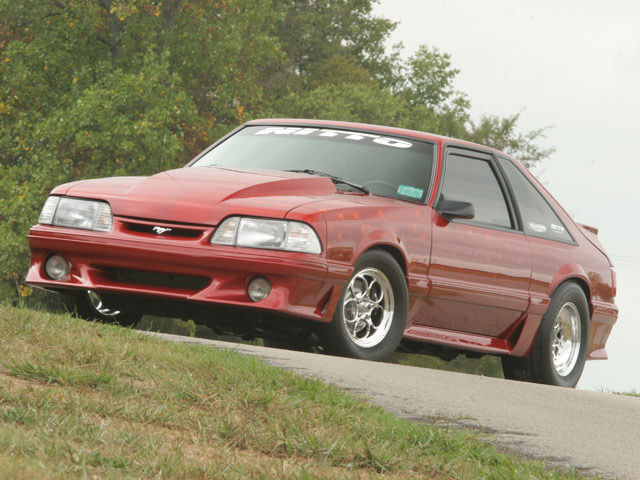 Custom Wild Strawberry with Candy Orange Flames 1991 Ford Mustang Hatchback with Gray interior
