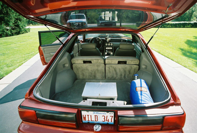 Custom Wild Strawberry with Candy Orange Flames 1991 Ford Mustang Hatchback with Gray interior